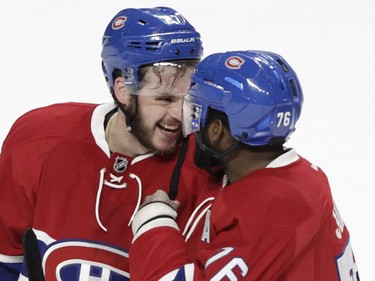 Alex Galchenyuk (left) of the Montreal Canadiens is congratulated by teammate P.K. Subban after his game-winning in the overtime period against the Dallas Stars in an NHL game at the Bell Centre in Montreal Tuesday, March 8, 2016.