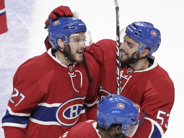 Alex Galchenyuk (left) of the Montreal Canadiens is congratulated by teammate Lucas Lessio after his game-winning in the overtime period againt the Dallas Stars in an NHL game at the Bell Centre in Montreal Tuesday, March 8, 2016.