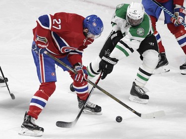 Habs' Alex Galchenyuk battles for puck with Stars' Johnny Oduya of Tuesday night at the Bell Centre.