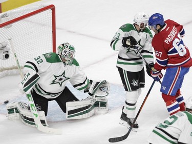 Captain Max Pacioretty of the Montreal Canadiens deflects a shot past goalie Kari Lehtonen of the Dallas Stars for a goal in the first period of an NHL game at the Bell Centre in Montreal Tuesday, March 8, 2016.