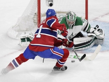 Stefan Matteau of the Montreal Canadiens is stopped by goalie Kari Lehtonen of the Dallas Stars in the third period of an NHL game at the Bell Centre in Montreal Tuesday, March 8, 2016.