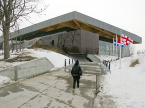 A child arrives at the the new $50-million-plus soccer complex at the Complexe environnemental St-Michel on Papineau Avenue in Montreal, Wednesday March 9, 2016.  The city assures the estimated cost for the complex, which began at $24 million won't exceed $52.6 million.