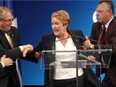 Parti Québécois leader Pauline Marois is taken away by security guards as she addresses political supporters at the Metropolis on Tuesday, Sept. 4, 2012.