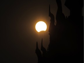 This picture shows the moon passing in front of the sun during a partial solar eclipse in Naypyidaw on March 9, 2016. A total solar eclipse swept across the vast Indonesian archipelago on March 9, witnessed by tens of thousands of sky gazers and marked by parties, Muslim prayers and tribal rituals. Partial eclipses were also visible over other parts of Asia and Australia.