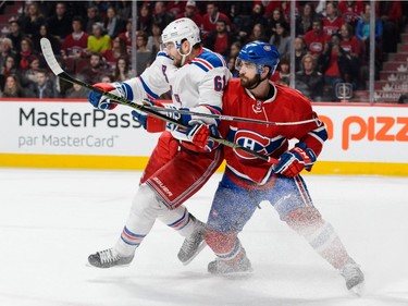 Greg Pateryn #6 of the Montreal Canadiens defends against Rick Nash #61 of the New York Rangers during the NHL game at the Bell Centre on March 26, 2016, in Montreal.