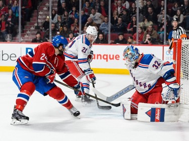 Phillip Danault #24 of the Montreal Canadiens shoots on goaltender Antti Raanta #32 of the New York Rangers and scores during the NHL game at the Bell Centre on March 26, 2016, in Montreal.