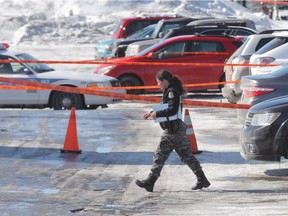 A police officer at the scene of a shooting Tuesday morning in Laval.