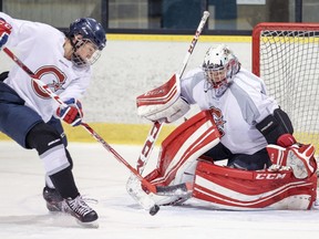 Canadiennes' Caroline Ouellette breaks in on Charline Labonté during practice on Feb. 16, 2016.