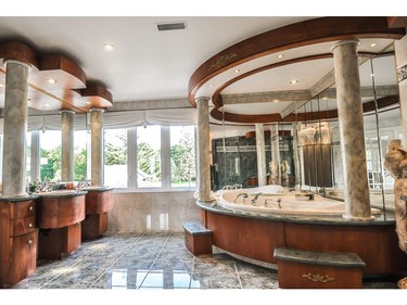 Opulent master bathroom in waterfront home in Île-Bizard. (Photo courtesy of Royal LePage Heritage)