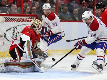 The Ottawa Senators took on the Montreal Canadiens at the Canadian Tire Centre in Ottawa Ontario Saturday March 19, 2016.  Senators Andrew Hammond makes a glove save against Canadiens Tomas Plekanec during second period action in Ottawa.
