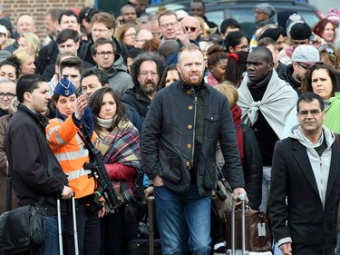 People are evacuated from Zaventem Airport in Brussels after an explosion on Tuesday, March 22, 2016.