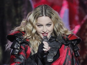 In this Feb. 20, 2016, file photo,  Madonna performs during the Rebel Heart World Tour in Macau, China.  (AP Photo/Kin Cheung)