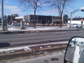 Police at the scene of the accident where a driver crashed into the Royal Bank outlet on St-Jean Blvd. in Dollard-des-Ormeaux. (Photo courtesy of Axel Waschke)