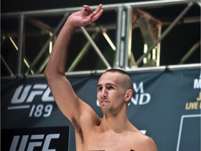 Welterweight fighter Rory MacDonald salutes the crowd during weigh-ins for UFC 189 mixed martial arts bouts, in Las Vegas on Friday, July 10, 2015.