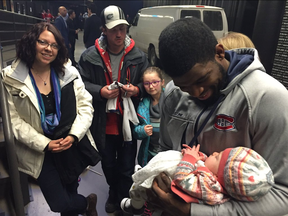 Canadiens P.K. Subban meets baby Béatrice. Photo take from Sean Farrell's Twitter account.