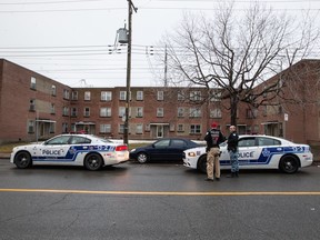 Montreal police in front of an apartment building on Bergevin St. in LaSalle, Montreal, Tuesday March 15, 2016. It was the second of two home invasions, the first being in Lachine. One person was injured in each incident.