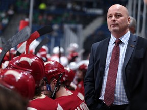 University of Denver head coach Jim Montgomery looks on as his team takes on Miami of Ohio during the National Collegiate Hockey Conference Frozen Faceoff Conference Championship at Target Center on March 20, 2015 in Minneapolis, Minnesota.  NOTE TO USER:  Mandatory Copyright Notice: Copyright 2015 David Sherman Photography