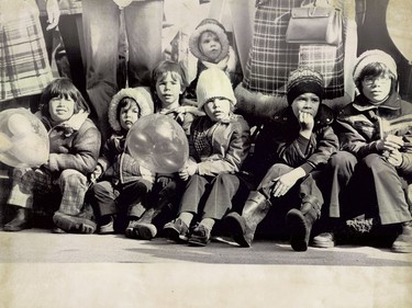 Children watch the parade unfold in Montreal in 1977.