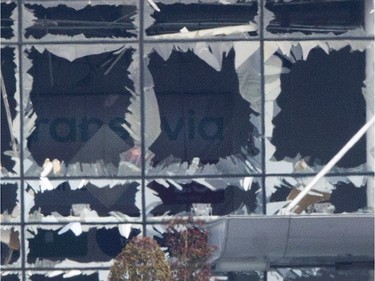 The blown out facade of the terminal is seen at Zaventem airport, one of the sites of two deadly attacks in Brussels, Belgium, Tuesday, March 22, 2016. Authorities in Europe have tightened security at airports, on subways, at the borders and on city streets after the attacks Tuesday on the Brussels airport and its subway system.