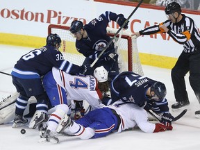 There's a crowd in the Winnipeg Jets' crease as they take on the Montreal Canadiens in Winnipeg on Saturday, March 5, 2016.