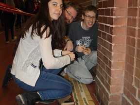 Staff and students stuck loonies to 800 feet of two-sided tape lining John Abbott College's hallways on March 16.