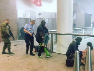 This photo provided by Georgian Public Broadcaster and photographed by Ketevan Kardava, shows the scene in Brussels Airport in Brussels, Belgium, after explosions were heard Tuesday, March 22, 2016.