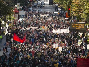 Thousands of protestors from a coalition of public sector unions march in the streets of Montreal Saturday, October 3, 2015. The protest included teachers, health workers and labour federation .