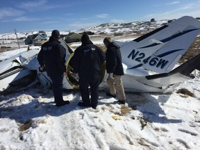 Transportation Safety Board of Canada investigators at the wreckage site in Havre-aux-Maisons in Îles-de-la-Madeleine on Wednesday, March 30, 2016, where a plane crashed on March 29 claiming the life of former federal cabinet minister Jean Lapierre and four members of his family as well as the two pilots.