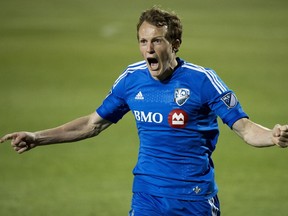 Montreal Impact's Wandrille Lefèvre reacts after his team scored a goal against the Toronto FC during second half semi-final Canadian Championship soccer action in Toronto on Wednesday, May 13, 2015.