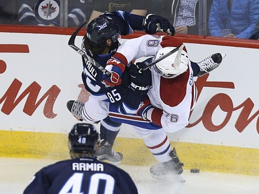Winnipeg Jets forward Mathieu Perreault (left) and Montreal Canadiens defenceman P.K. Subban get tangled up in Winnipeg on Sat., March 5, 2016.
