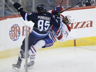 Winnipeg Jets' Mathieu Perreault (85) checks Montreal Canadiens' P.K. Subban (76) deep in the Habs' zone during first period NHL action in Winnipeg on Saturday, March 5, 2016.