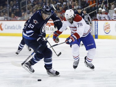 Winnipeg Jets' Mark Scheifele (55) steals the puck from Montreal Canadiens' P.K. Subban (76) and goes on to score during second period NHL action in Winnipeg on Saturday, March 5, 2016.