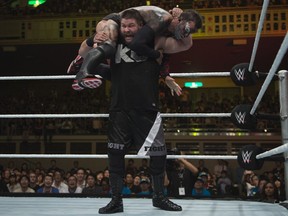 World Wrestling Entertainment superstar and Quebec native Kevin Owens holds his opponent, Finn Balor, on his shoulders during NXT Takeover in Tokyo in 2015. Owens will make his WrestleMania debut in Dallas on April 3. (Courtesy World Wrestling Entertainment)