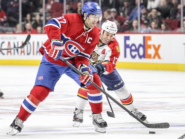 Max Pacioretty takes a shot while being chased by the Panthers' Derek MacKenzie during third period in Montreal on Tuesday, April 5, 2016.
