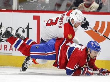 Tomas Plekanec is checked by Florida Panthers' Steven Kampfer during second period in Montreal on Tuesday April 5, 2016.