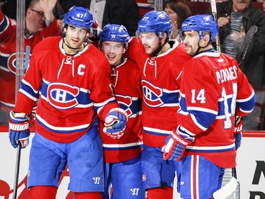 Montreal Canadiens, from left, Max Pacioretty, Brendan Gallagher, Alex Galchenyuk and Tomas Plekanec celebrate Galchenyuk's goal against the Florida Panthers during second period in Montreal on Tuesday, April 5, 2016.