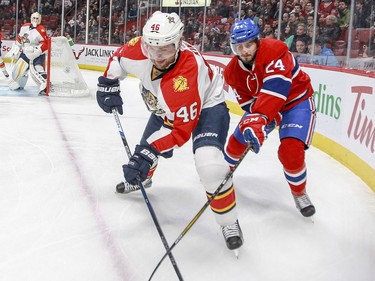 Phillip Danault competes for the puck with the Panthers' Jakub Kindl during first period in Montreal Tuesday. April 5, 2016.