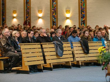 Lapierre family members listen to a commemorative mass for the victims of the March 2 airplane crash at Sainte-Madeleine de Havre-aux-Maisons church in Les Iles de la Madeleine on Tuesday, April 5, 2016.