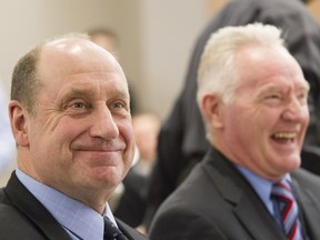 Former Montreal Canadiens stars Bob Gainey (left) and Larry Robinson have a laugh at the Sports Celebrity Breakfast at the Cummings Jewish Centre for Seniors in Montreal Sunday, April 10, 2016.