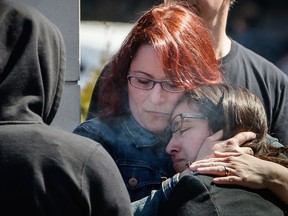 Mourners embrace as they arrive for the funeral of 20 year-old Clémence Beaulieu-Patry outside an Alfred Dallaire funeral home in Montreal on Sunday, April 17, 2016. (Dario Ayala / Montreal Gazette)