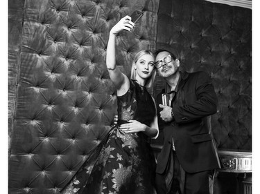 Actress Sarah Gadon poses with Fashion Photographer of the year Gabor Jurina at the Canadian Arts & Fashion Awards studio during the Toronto gala, April 15, 2016.