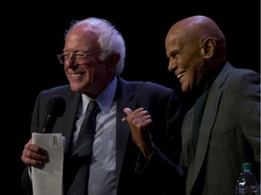 Democratic presidential candidate, Sen. Bernie Sanders, I-Vt., is joined on stage by Harry Belafonte as he speaks at a campaign event at the Apollo Theatre, Saturday, April 9, 2016, in the Harlem neighborhood of Manhattan.