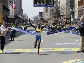 Atsede Baysa, of Ethiopia, breaks the tape to win the women's division of the 120th Boston Marathon on Monday, April 18, 2016.