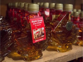 Canadian maple syrup sits on a shelf in a store in Ottawa, Monday, Oct. 21, 2013.