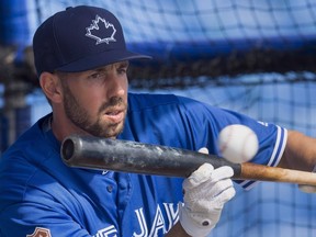 Toronto Blue Jays first baseman Chris Colabello lays down a bunt during batting practice at spring training in Dunedin, Fla., on Wednesday, March 2, 2016. Colabello has been suspended for 80 games without pay after testing positive for a performance-enhancing substance.