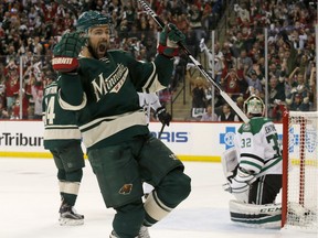 Minnesota Wild left wing Chris Porter (7) celebrates after scoring on Dallas Stars goalie Kari Lehtonen (32) during the first period of Game 3 in the first round of the NHL Stanley Cup playoffs in St. Paul, Minn., Monday, April 18, 2016.