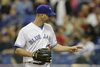 Toronto Blue Jays starting pitcher J.A. Happ gestures during the first inning of their exhibition game against the Boston Red Sox at the Olympic Stadium in Montreal on Friday, April 1, 2016.
