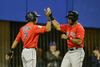 Boston Red Sox infielder Mauricio Dubon, left, and teammate Chris Young, right, celebrate their runs during their exhibition game at the Olympic Stadium in Montreal on Friday, April 1, 2016.