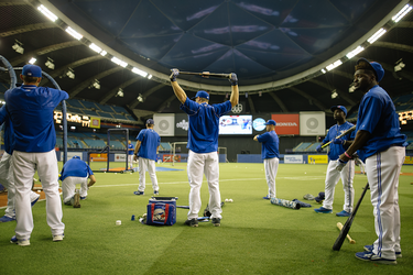 Toronto Blue Jays players warm up ahead of their exhibition match against the Boston Red Sox Olympic Stadium in Montreal on Friday, April 1, 2016.