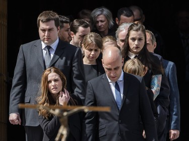 Children of former MP and media personality Jean Lapierre, Marie-Anne Lapierre, front left, and her brother Jean Michel Lapierre, top left, and Marie-Anne's spouse Mathieu Belhumeur, front right, leave the funeral service of Jean Lapierre and his wife Nicole Beaulieu at the end of their funeral at Saint-Viateur-d'Outremont church in Montrealon Saturday, April 16, 2016. The couple died on March 29 in an airplane crash along with Lapierre’s siblings Louis Lapierre, Marc Lapierre, and Martine Lapierre as well as pilots Pascal Gosselin and Fabrice Labourel. The group was heading to Les Iles-de-la-Madeleine for the funeral of their father Raymond Lapierre.